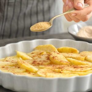 baker preparing apple crisp with oats