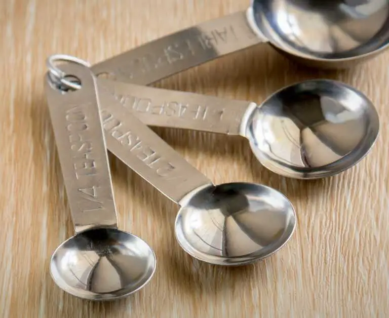 how many teaspoons in an ounce. set of measuring spoons on a table