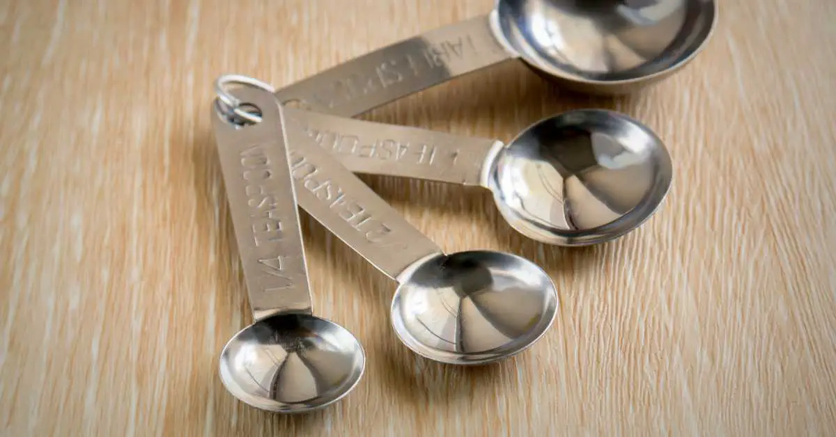 how many teaspoons in an ounce. set of measuring spoons on a table